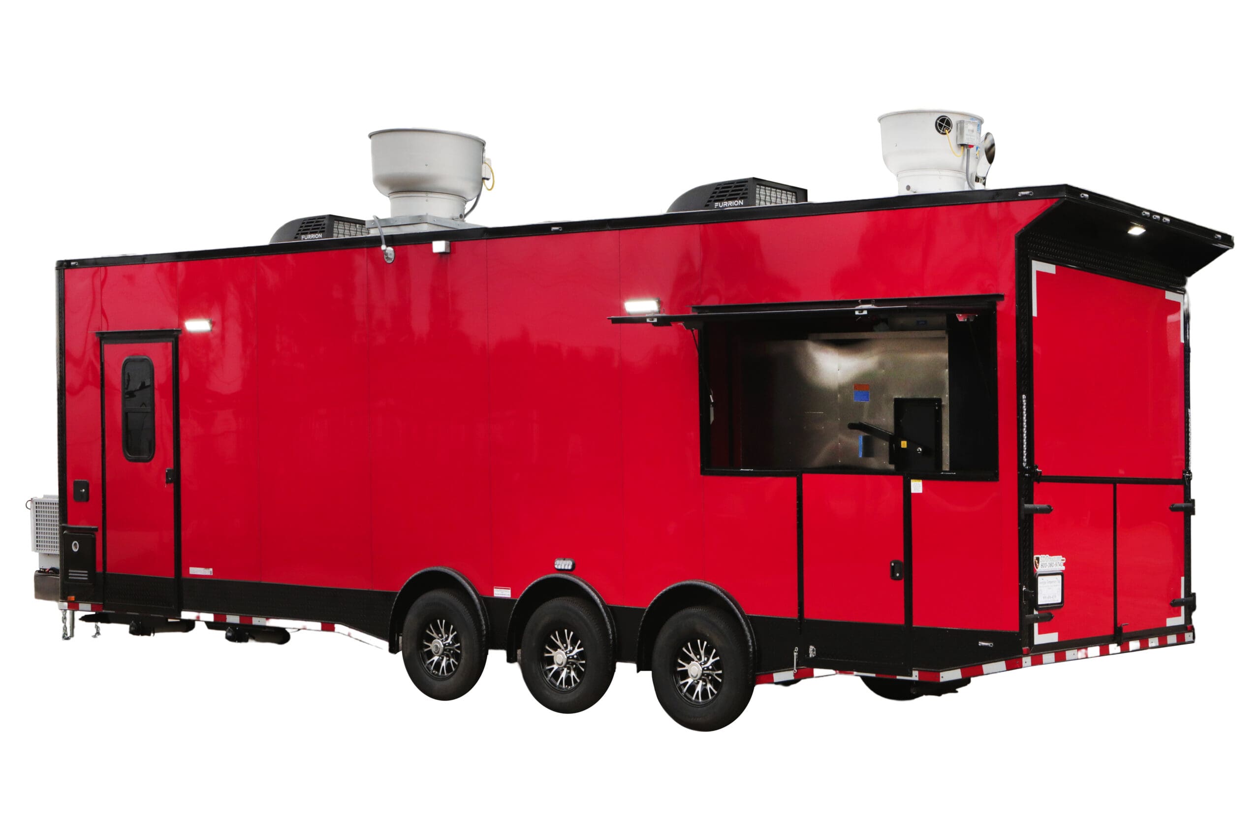 A bright red, triple-axle food or concession trailer with a large serving window, a side entry door, and two roof-mounted exhaust fans, one with "FURRION" visible on it